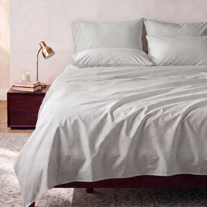 Lane Linen Organic Cotton Sheet Set in Glacier Grey - styled on a bed