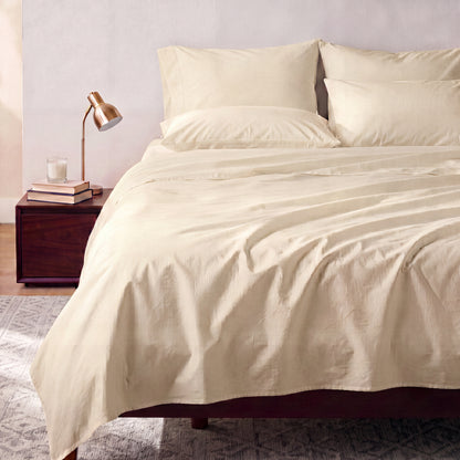 Lane Linen Organic Cotton Sheet Set in Natural - styled on a bed