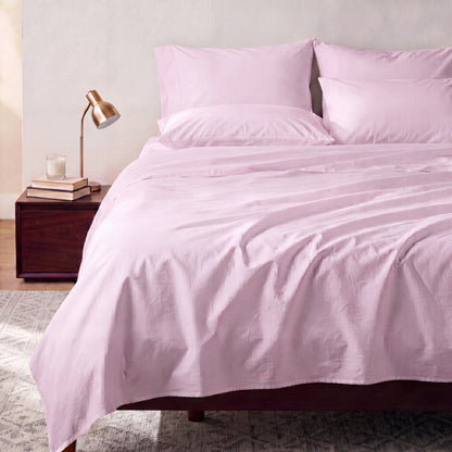 Lane Linen Organic Cotton Sheet Set in Orchid Petal - styled on a bed