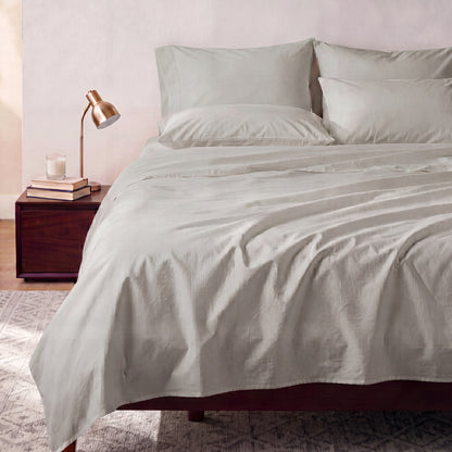 Lane Linen Organic Cotton Sheet Set in Silver - styled on a bed